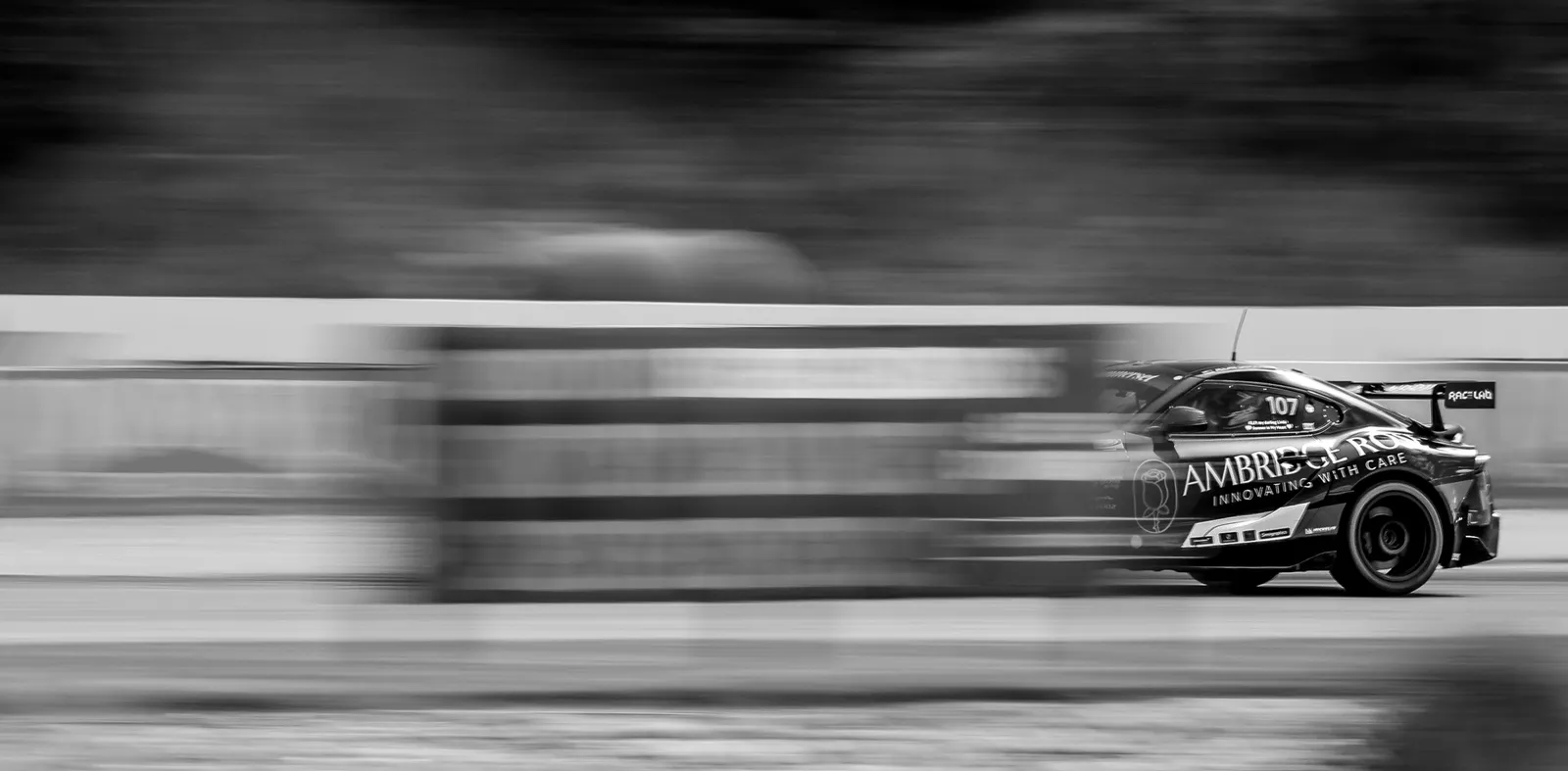 Black and white race car speeding